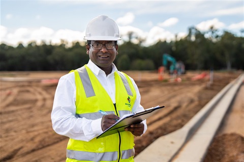 Council staff smiling at work site