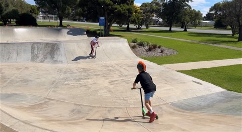 Children riding scooters