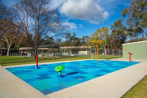 Splash park next to swimming pool